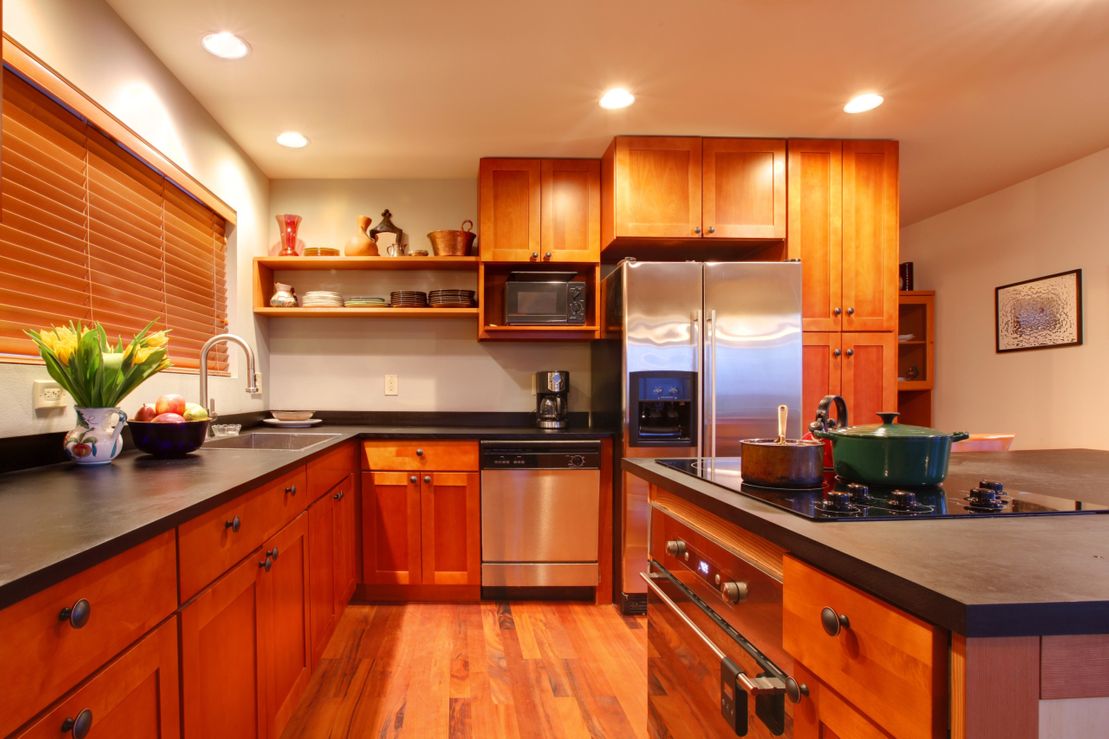 Solid wood kitchen with dark granite countertop
